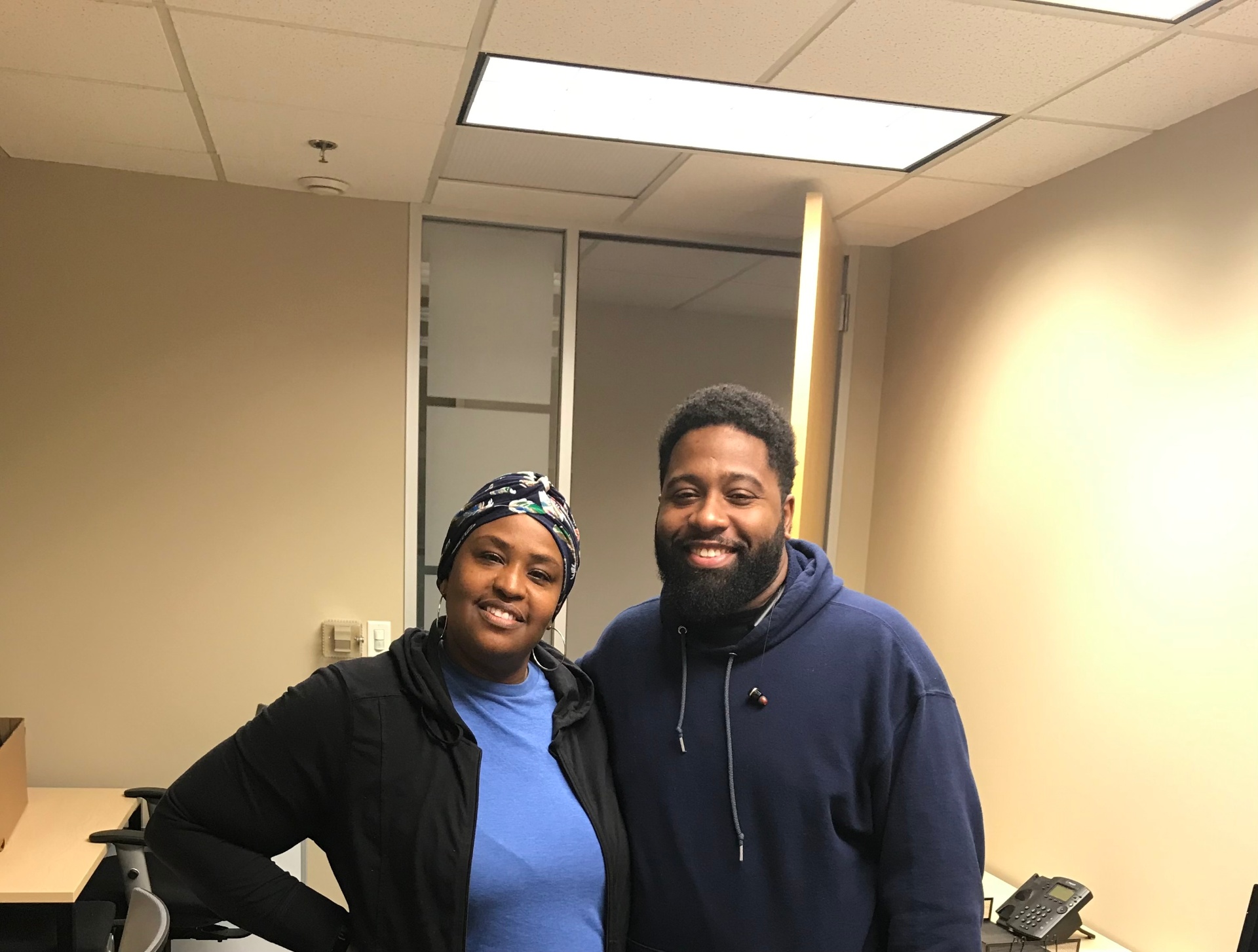 Kalisa Vaughn with a client at the tax office providing volunteer tax help